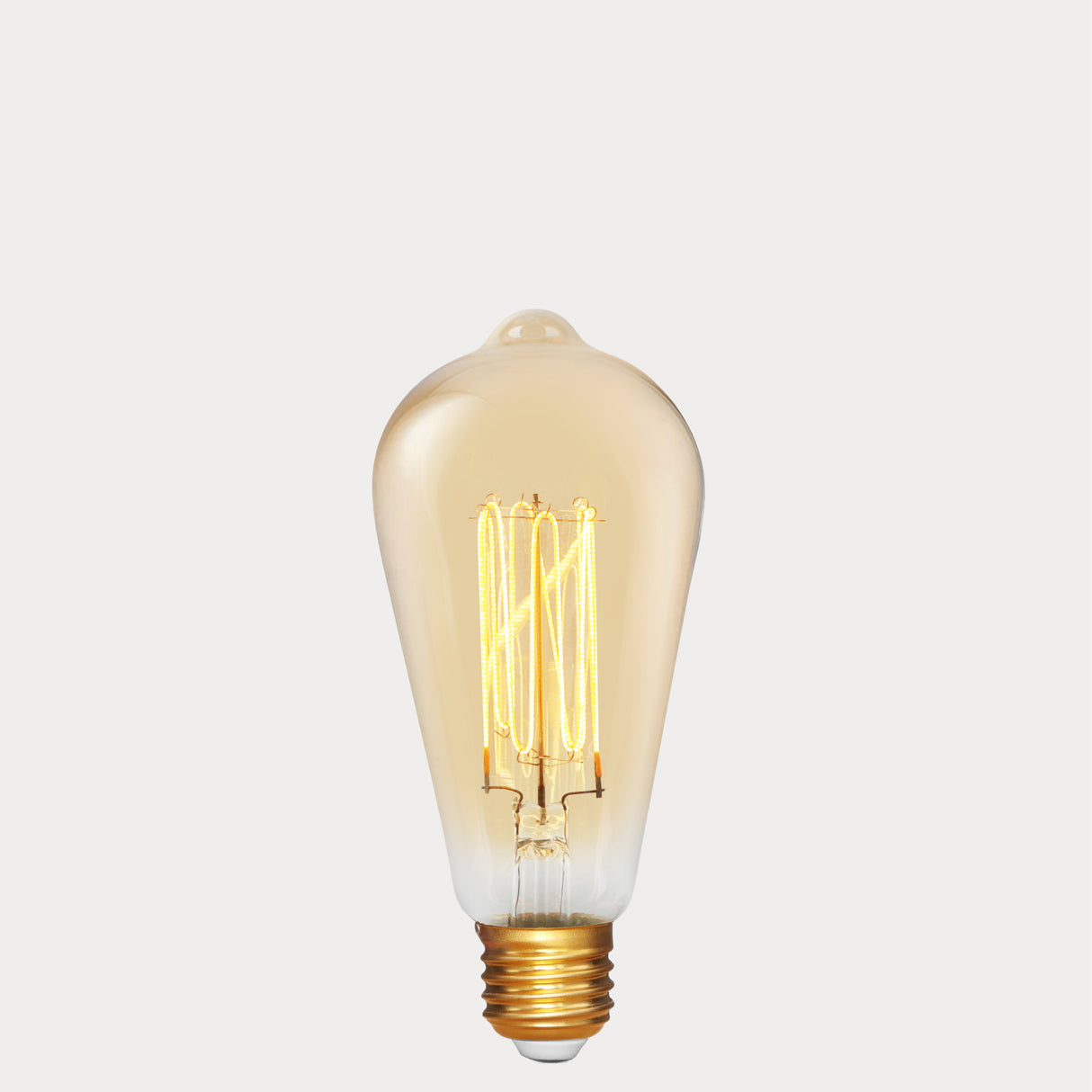 Dulora 4W Edison Vintage LED Bulb E27 in Ultra Warm White glowing deep amber through vintage ST64 glass
