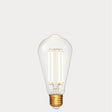 Dulora 4.2W Edison LED Bulb E27 in Extra Warm White illuminated showing warm amber glow through clear ST64 glass